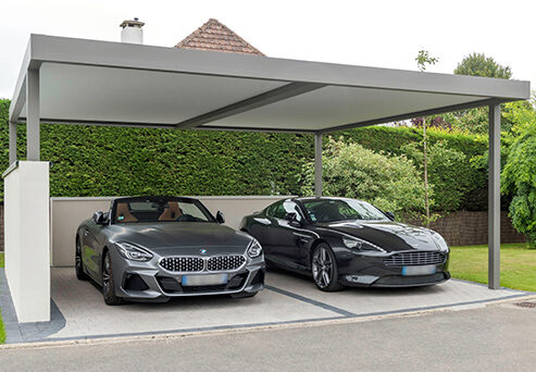 Carport double avec deux voitures de sports